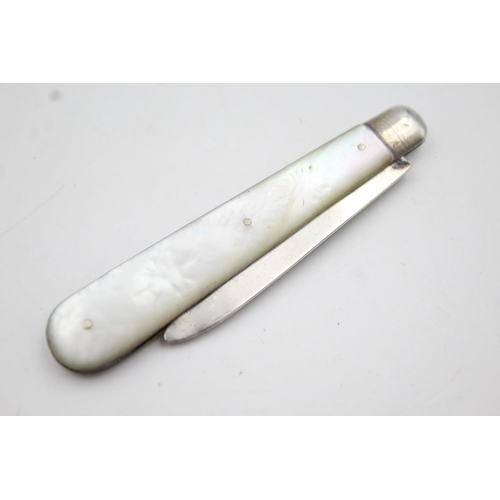 414 - Two hallmarked sterling silver and mother of pearl fruit knives - approx. gross weight 28 grams