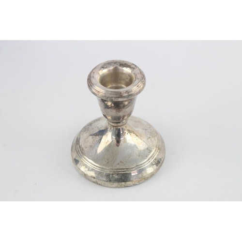 416 - Two hallmarked Birmingham silver squat filled candlesticks, dated 1988 - approx. 7.5cm high