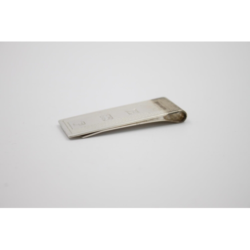 418 - A hallmarked Birmingham gents money clip by William Manton, dated 1980 - approx. gross weight 16 gra... 