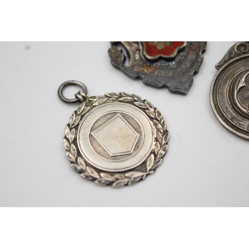 421 - Three assorted hallmarked sterling silver fobs/medallions - approx. gross weight 32 grams