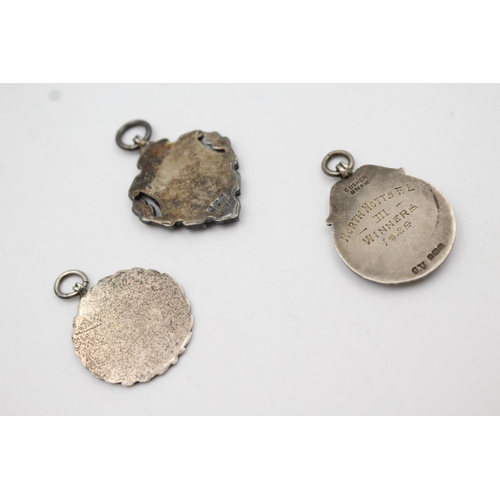 421 - Three assorted hallmarked sterling silver fobs/medallions - approx. gross weight 32 grams