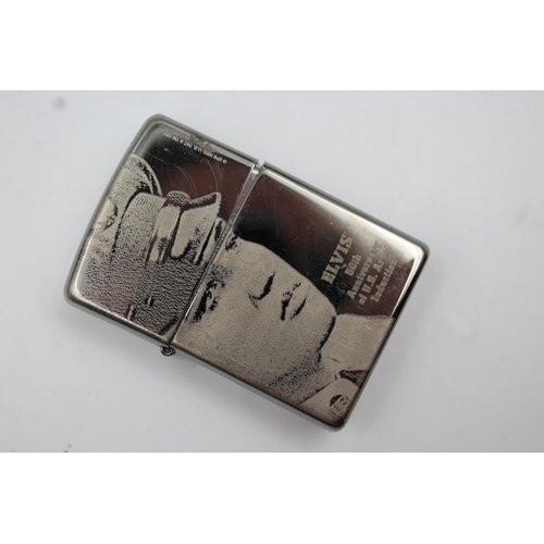 427 - Two Zippo cigarette lighters, one pirate themed and one Elvis Presley 50th Anniversary of U.S Army i... 