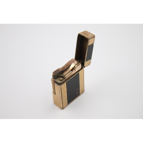 428 - A St. Dupont of Paris black lacquer and gold plated cigarette lighter - ref no. BT0222