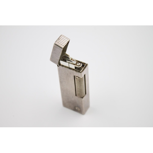 430 - A Dunhill silver plated cigarette lighter