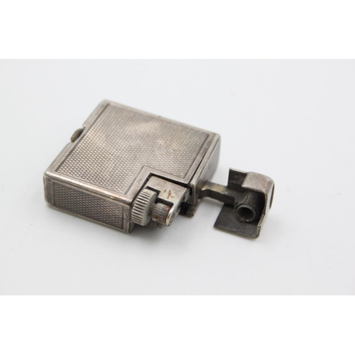 432 - A Dunhill silver plated cigarette lighter