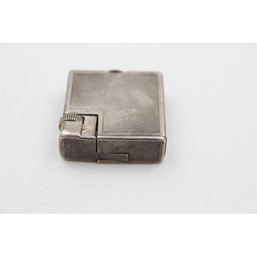 432 - A Dunhill silver plated cigarette lighter