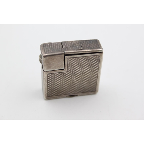 432 - A Dunhill silver plated cigarette lighter