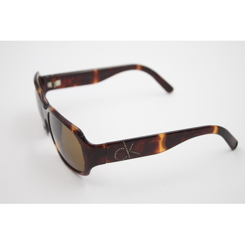 445 - A pair of Calvin Klein tortoiseshell effect oversize ladies fashion sunglasses