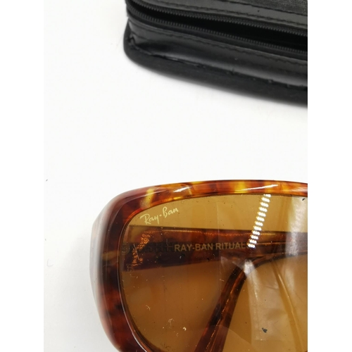 453A - A pair of Rayban tortoiseshell effect sunglasses with leather case