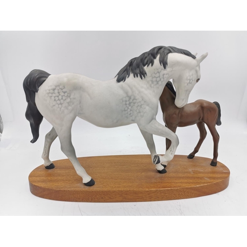 460 - A Beswick Spirit of Affection figurine on wooden plinth - approx. 20.5cm high x 31cm long