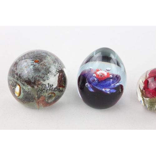 506 - Six assorted glass paperweights to include Thorneycroft, Haford Grange, two Caithness etc.