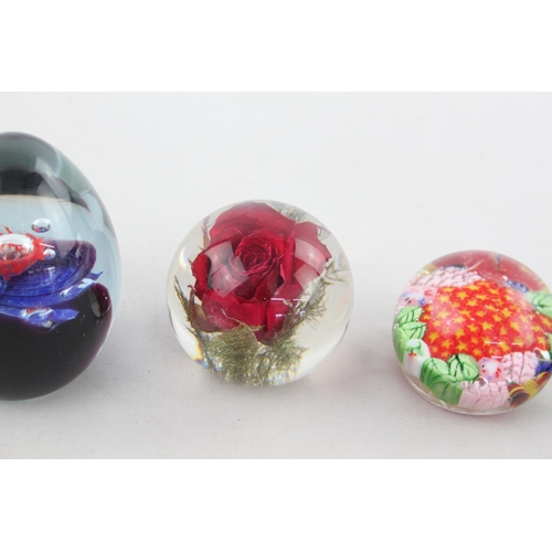 506 - Six assorted glass paperweights to include Thorneycroft, Haford Grange, two Caithness etc.