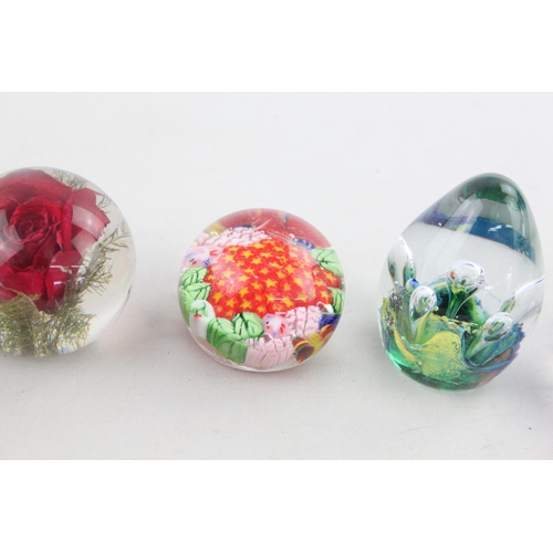 506 - Six assorted glass paperweights to include Thorneycroft, Haford Grange, two Caithness etc.