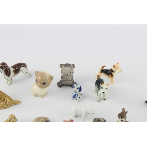 508 - A collection of assorted ceramic animal figurines to include Delft Ware duck, Wade Whimsies etc.