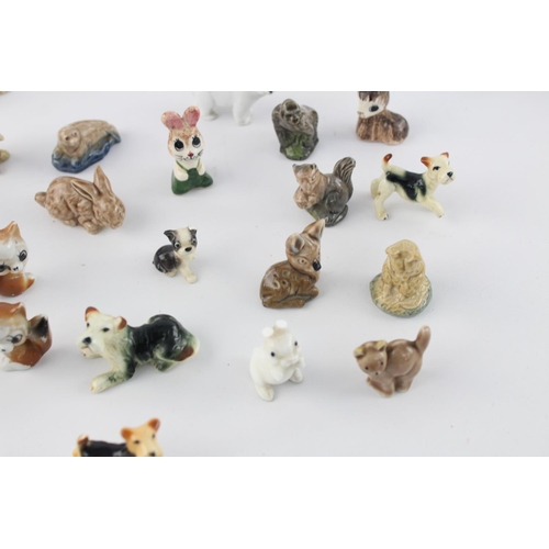 508 - A collection of assorted ceramic animal figurines to include Delft Ware duck, Wade Whimsies etc.