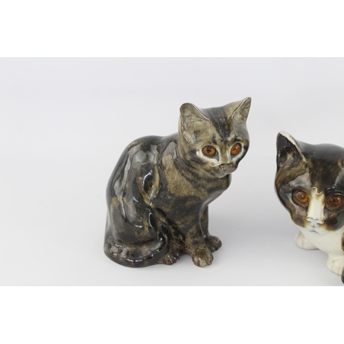 513 - Two 1980s Mike Hinton Winstanley pottery cats with glass eyes