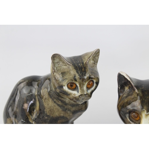 513 - Two 1980s Mike Hinton Winstanley pottery cats with glass eyes