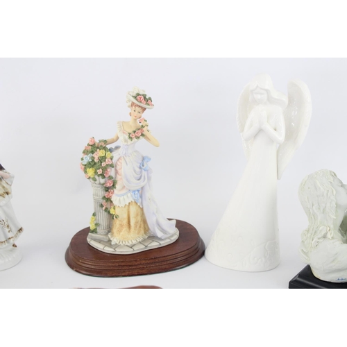 515 - A collection of assorted ceramic figurines to include Belleek, Wade Whimsies, Galos etc.