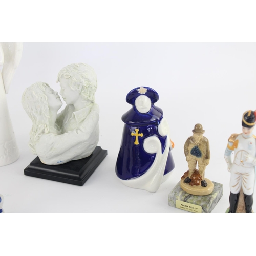 515 - A collection of assorted ceramic figurines to include Belleek, Wade Whimsies, Galos etc.