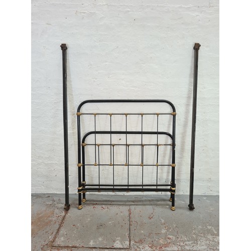 1120B - A Victorian black metal single bed frame