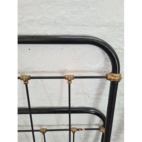 1120B - A Victorian black metal single bed frame