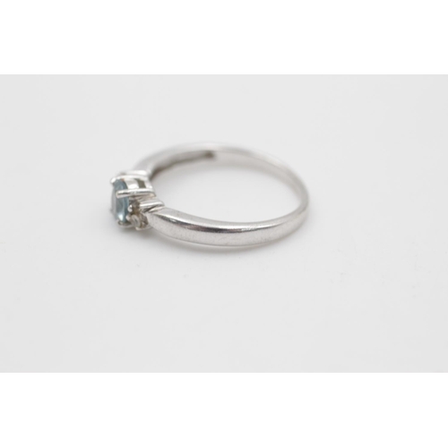 105 - A hallmarked Birmingham 9ct white gold aquamarine ring, size O - approx. gross weight 2.3 grams