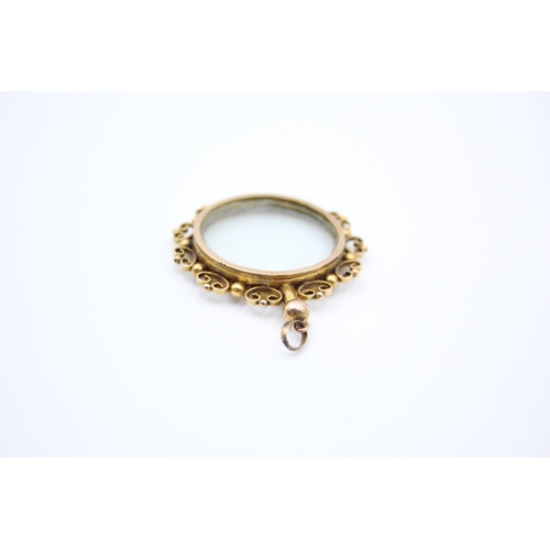 106 - An antique 9ct gold framed double sided locket - approx. gross weight 7.1 grams