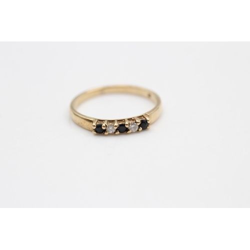 107 - A hallmarked Birmingham 9ct gold diamond and sapphire ring, size L - approx. gross weight 1.4 grams