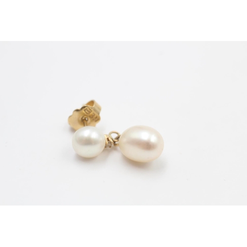 110 - A pair of 14ct gold pearl and diamond drop earrings - approx. gross weight 4.7 grams