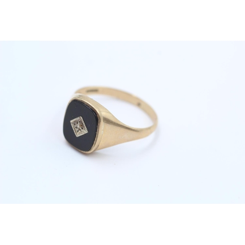 111 - A hallmarked Birmingham 9ct gold diamond and black onyx signet ring, size U ½ - approx. gross weight... 