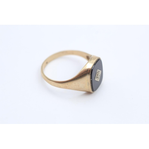 111 - A hallmarked Birmingham 9ct gold diamond and black onyx signet ring, size U ½ - approx. gross weight... 