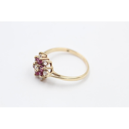 113 - A hallmarked London 9ct gold ruby and gemstone cluster ring dated 1984, size O ½ - approx. gross wei... 