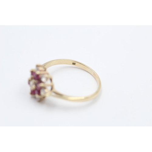 113 - A hallmarked London 9ct gold ruby and gemstone cluster ring dated 1984, size O ½ - approx. gross wei... 