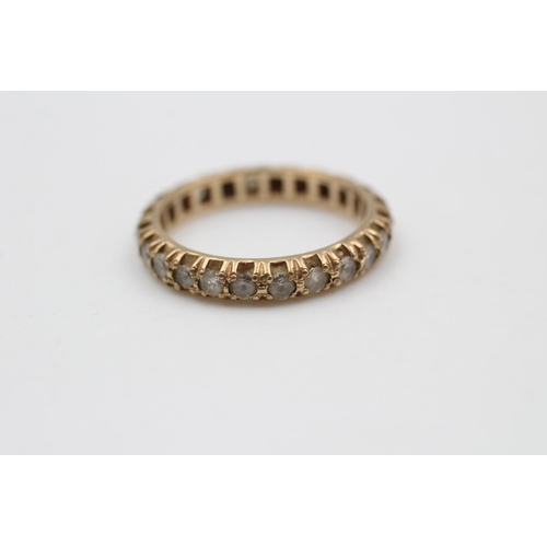 115 - A 9ct gold full eternity gemstone ring, size P ½ - approx. gross weight 3.3 grams