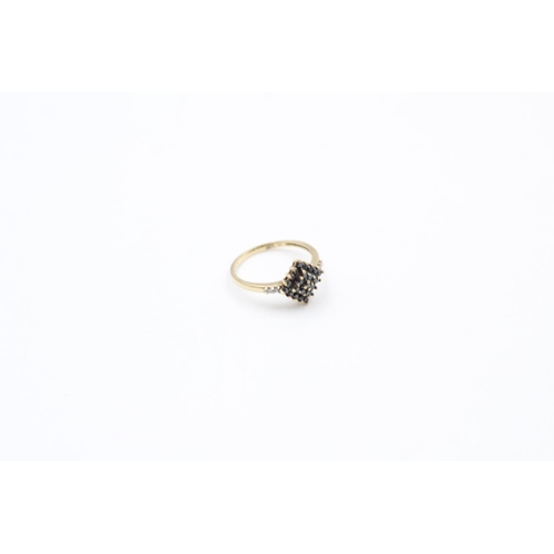 118 - A hallmarked London 9ct gold black and white diamond cluster ring, size P ½ - approx. gross weight 2... 