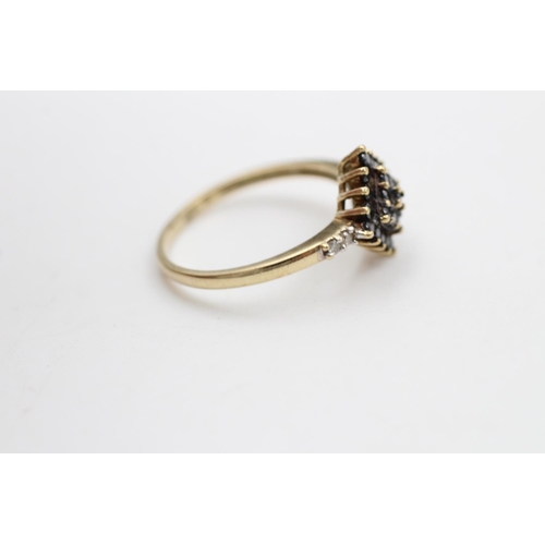 118 - A hallmarked London 9ct gold black and white diamond cluster ring, size P ½ - approx. gross weight 2... 