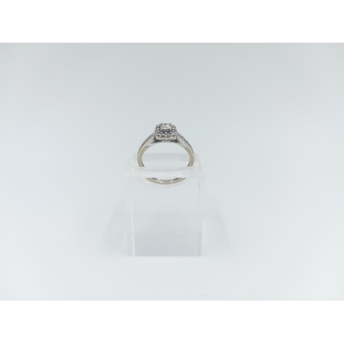 125 - A hallmarked London 9ct white gold diamond halo engagement ring, size K - approx. gross weight 2.1 g... 