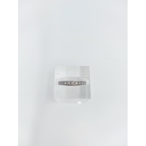 124 - A 9ct white gold 0.10ct diamond half eternity ring, size K ½ - approx. gross weight 1.84 grams