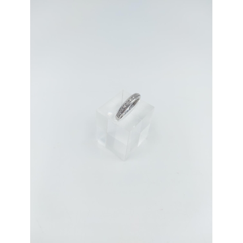 124 - A 9ct white gold 0.10ct diamond half eternity ring, size K ½ - approx. gross weight 1.84 grams