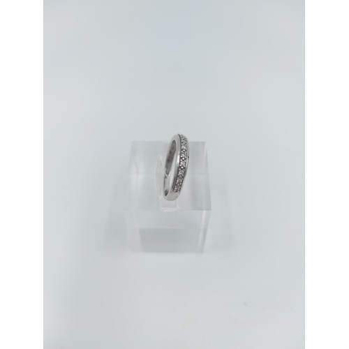 124 - A 9ct white gold 0.10ct diamond half eternity ring, size K ½ - approx. gross weight 1.84 grams