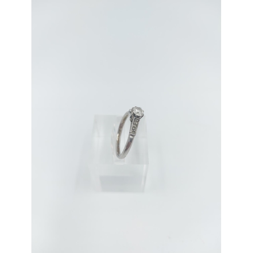 122 - A platinum diamond solitaire ring, size O ½ - approx. gross weight 2.16 grams