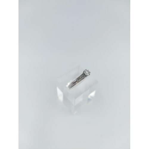 122 - A platinum diamond solitaire ring, size O ½ - approx. gross weight 2.16 grams