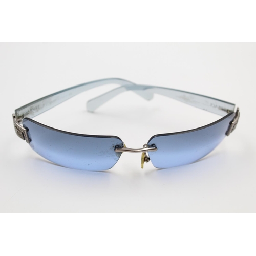 175 - A pair of Versace 00s style blue tint frameless ladies statement sunglasses with case