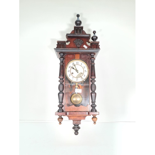 442 - A vintage stained pine wall clock with pendulum & key - approx. 75cm high