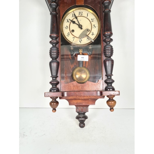 442 - A vintage stained pine wall clock with pendulum & key - approx. 75cm high