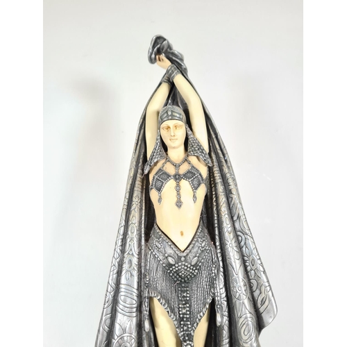 509 - An Art Deco style resin female figurine with pewter finish cloak on marble base - approx. 57cm high