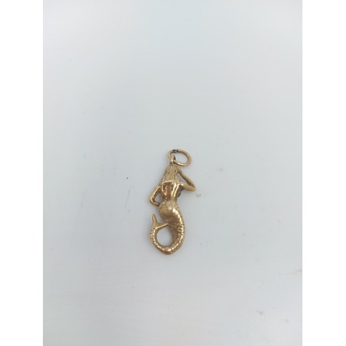 122A - A hallmarked 9ct yellow gold mermaid pendant - approx. gross weight 3.10 grams