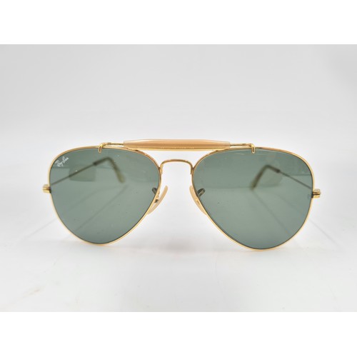 176 - A pair of vintage Bausch & Lomb Ray-Ban gold tone Aviator sunglasses with case