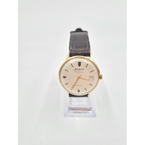 142 - A vintage Glashütte Spezimatic men's automatic gold tone wristwatch with brown leather strap