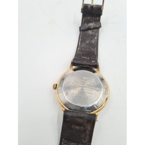 142 - A vintage Glashütte Spezimatic men's automatic gold tone wristwatch with brown leather strap